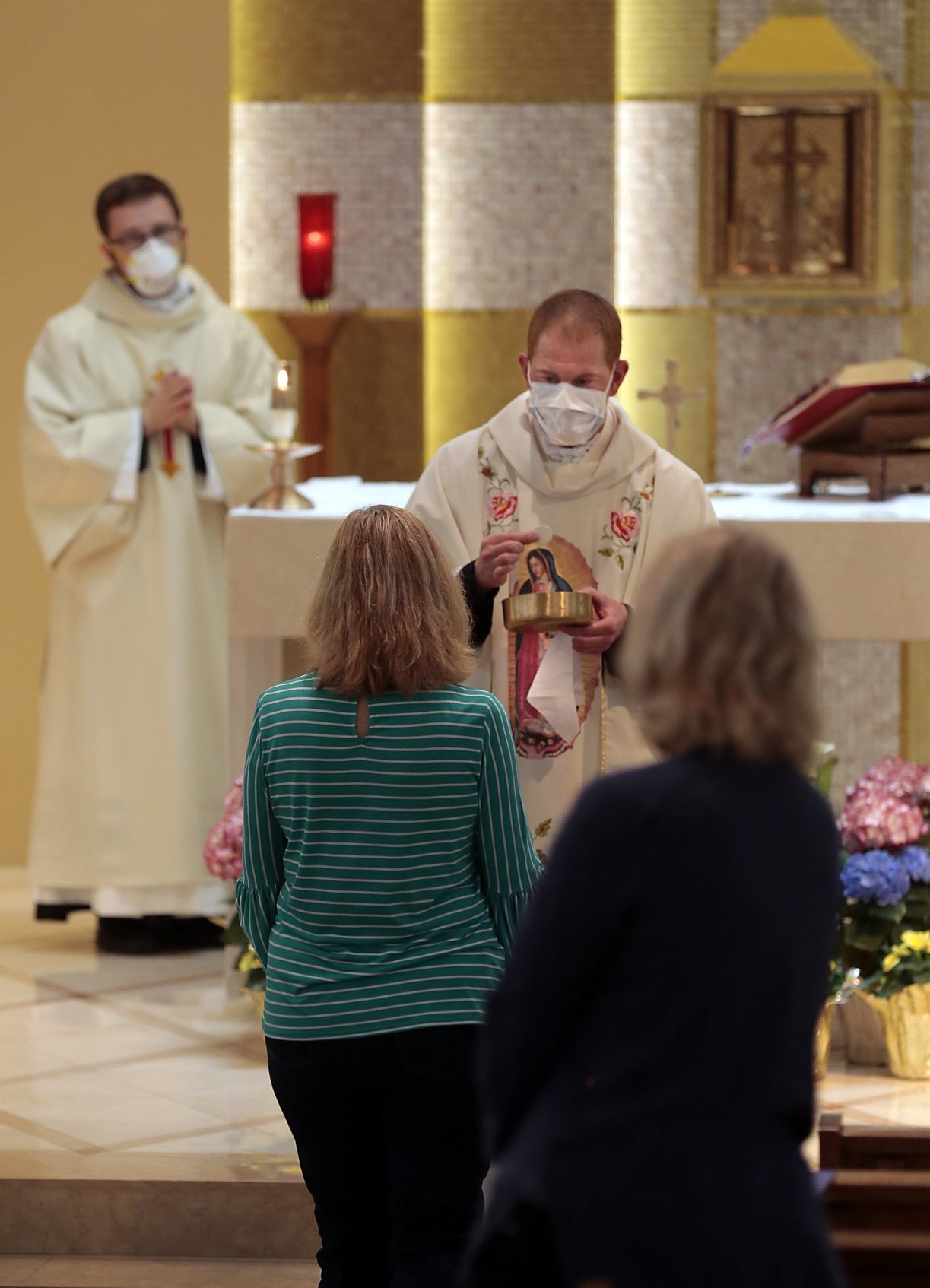 Parishioners return to Mass